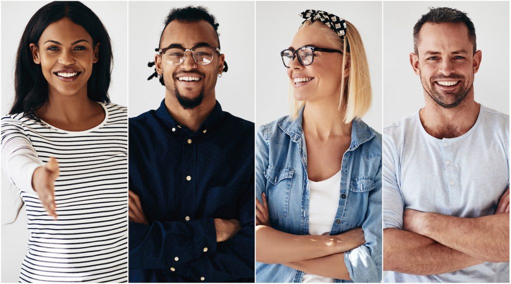 Group of diverse young entrepreneurs smiling against a white bac